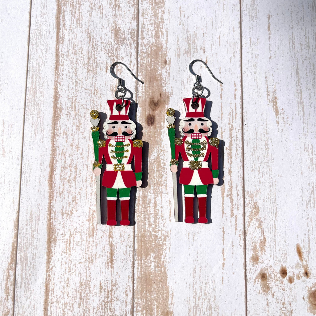 Handcrafted on stainless steel earring wires. Wood painted nutcracker cutouts.