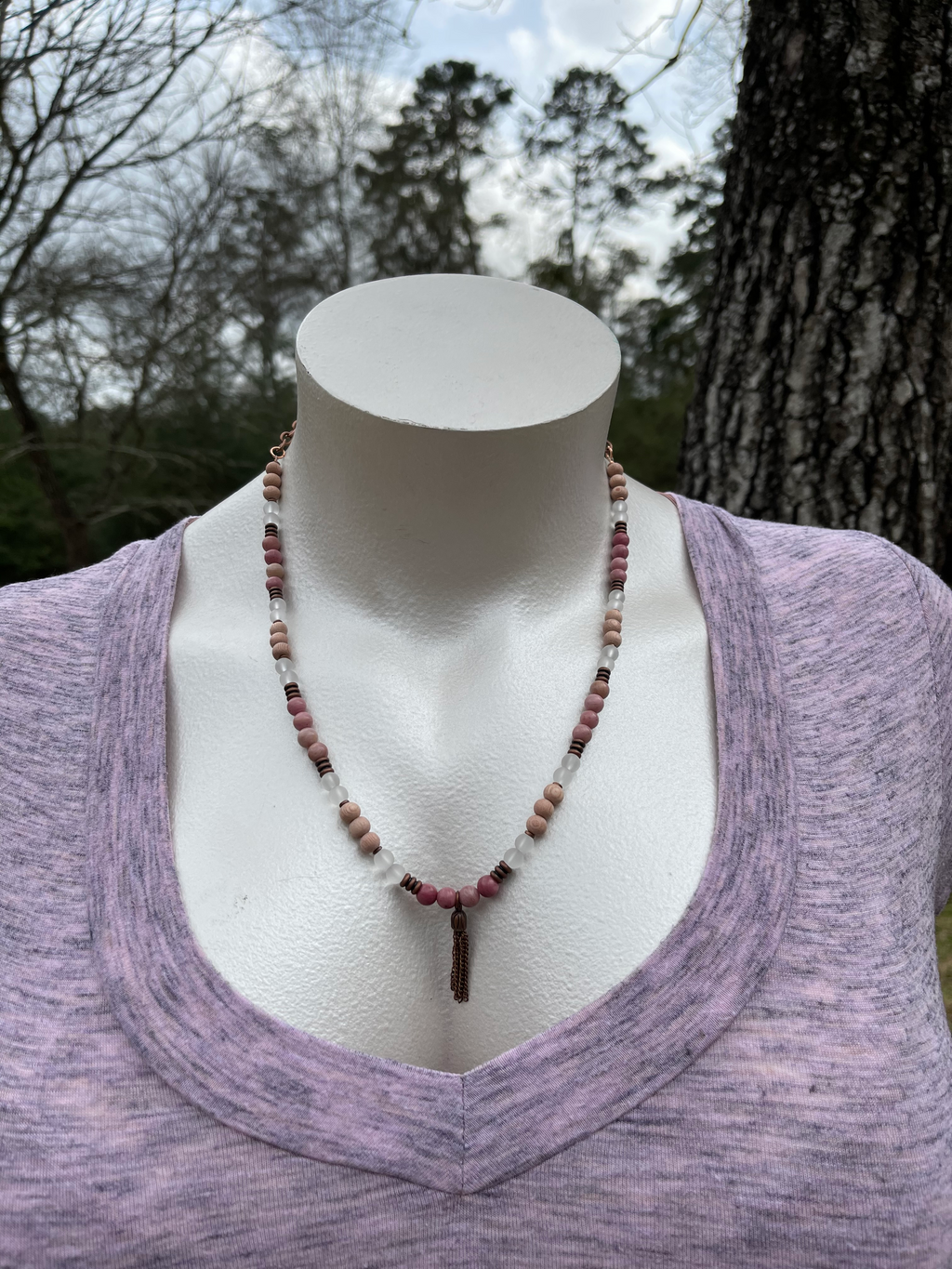 Handcrafted with antique copper tubes and spacer beads, antique copper chain and tassel, rosewood, matte clear quartz, and rhodonite stones.  Necklace is 24 inches in length with a 2 inch extender.