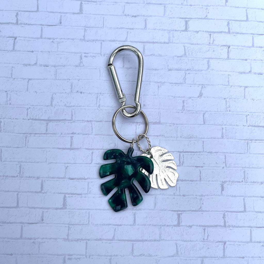 Handcrafted keychain on attached with a spring clip hook. Sterling silver plated monstera leaf pendant. Green and black acetate monstera leaf with opalescent finish.  Length in total is 4 1/2 inches.