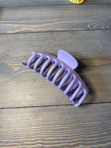 Jellyfish hair claw clip.  Solid color, matte purple. 100% Plastic. 4.33”