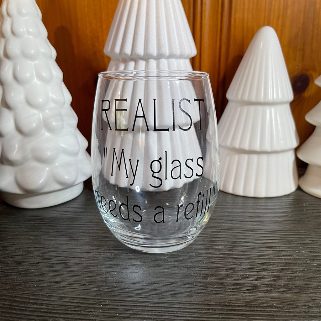 Glass stemless wine glass adorned with witty saying in permanent vinyl. Holds 20 ounces of liquid. Care instructions: Hand wash only, not dishwasher safe, do not microwave, and do not soak. 