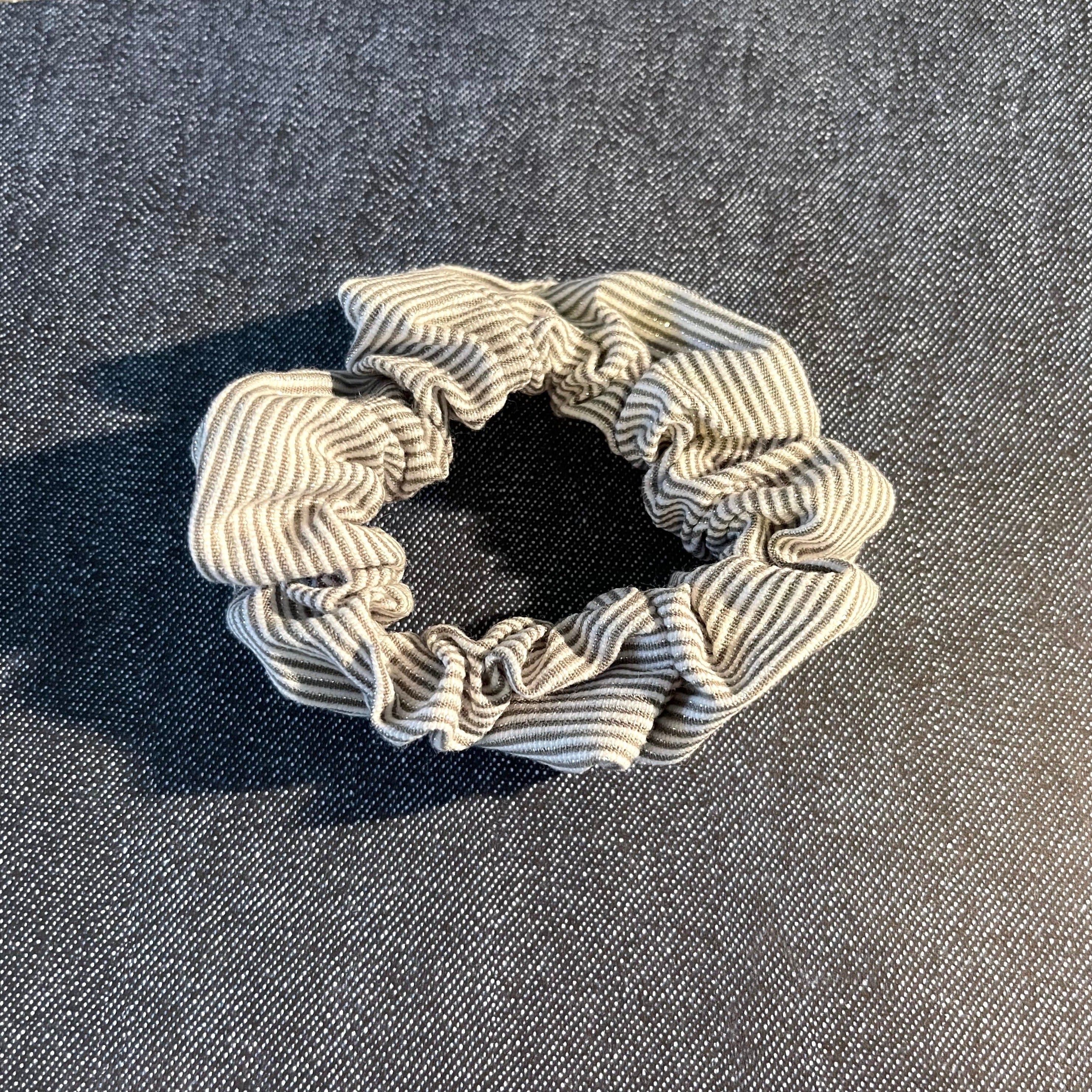 White-and-gray striped with silver threads classic hair scrunchie.